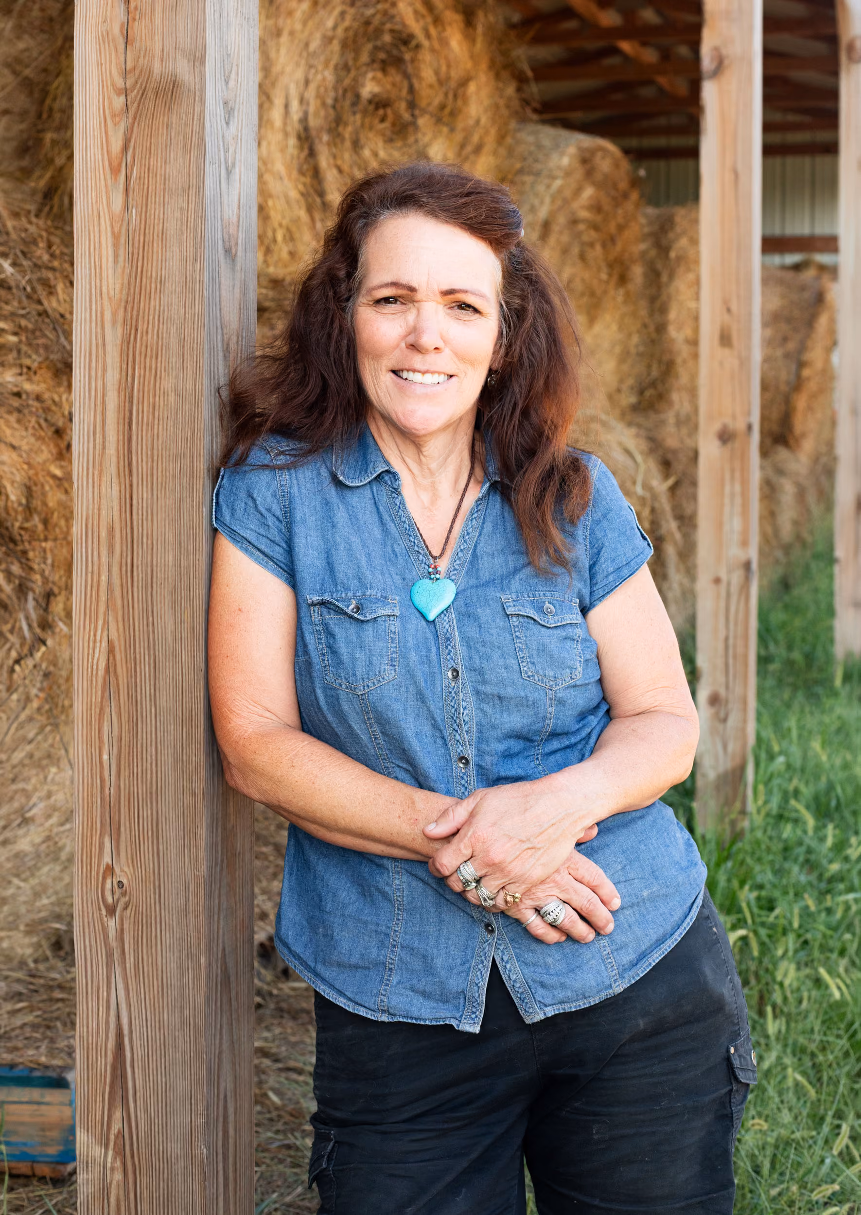 Robin Tinsley standing beside a barn doorway